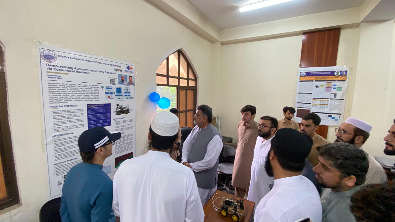 My respected teachers and honourable Vice Chancellor listening to my work at the poster presentation exhibition at the Department of Computer Science, Islamia College Peshawar